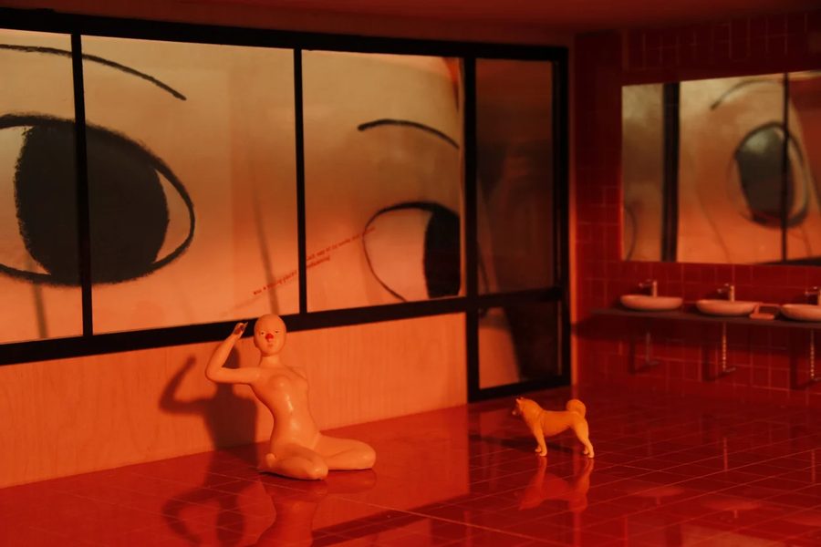 Red-toned interior scene with humanoid figures and surreal c, 2021