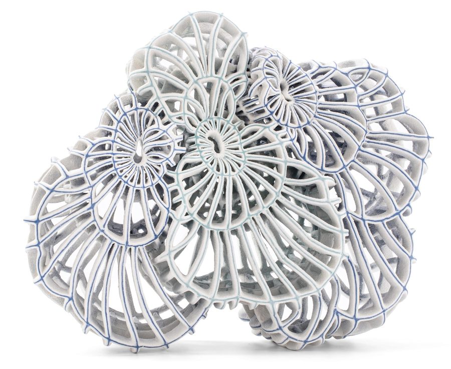 an abstract ceramic sculpture with blue porcelain and white, 2025