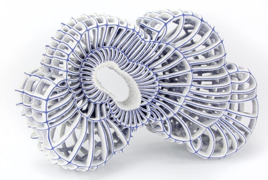an abstract ceramic sculpture with blue porcelain and white, 2025